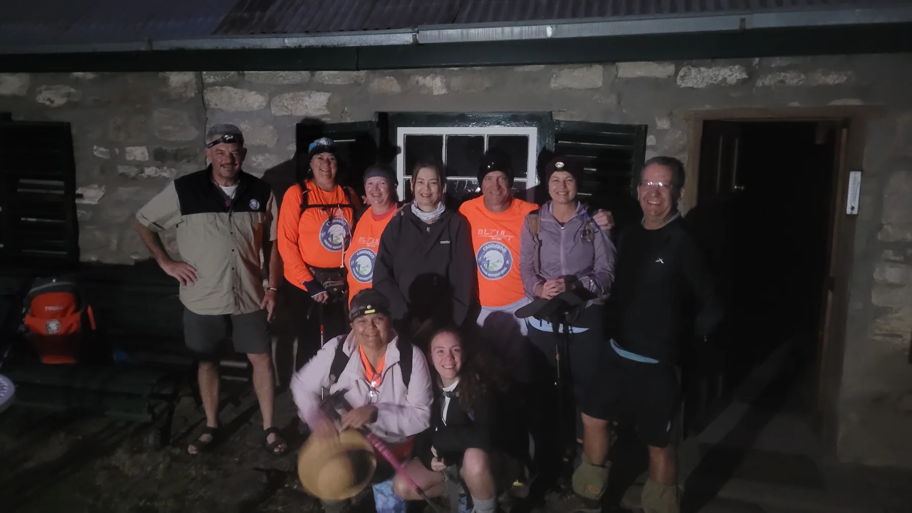 Full Moon Walk group gathered outside a Karoo farm building at night