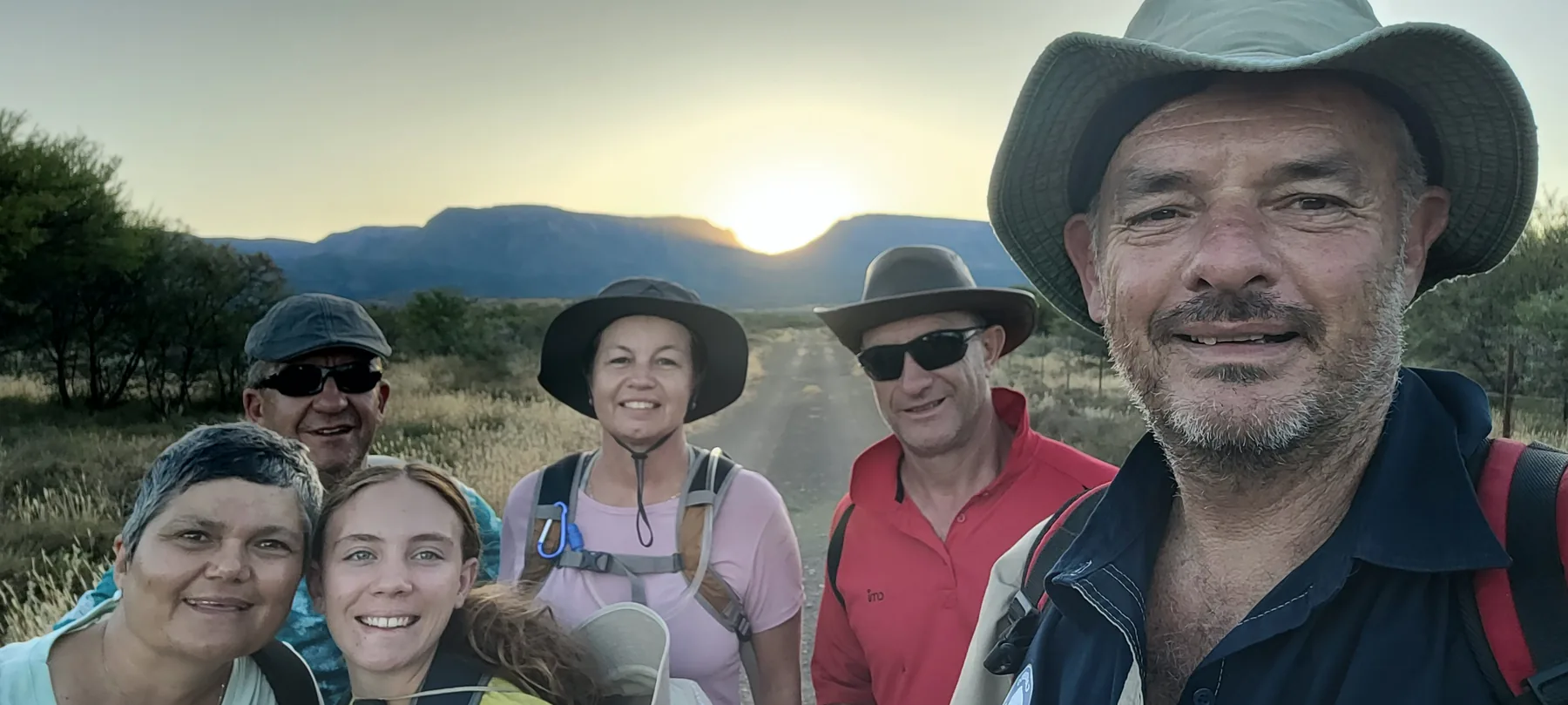 Full Moon Walk participants walking together at sunrise in the Karoo