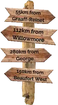 Karoo signpost showing distances from Aberdeen: 55 km from Graaff-Reinet, 112 km from Willowmore, 280 km from George and 150 km from Beaufort West